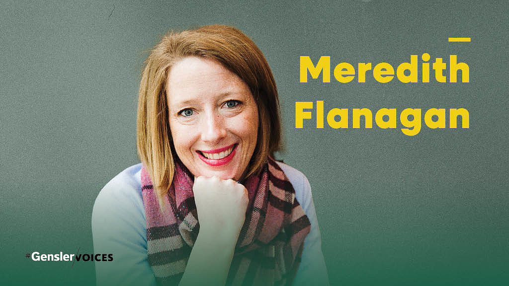 A woman with her hand on her chin.